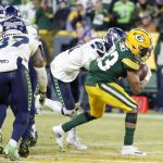 Green Bay Packers' Aaron Jones runs for a touchdown during the first half of an NFL divisional playoff football game against the Seattle Seahawks Sunday, Jan. 12, 2020, in Green Bay, Wis. (AP Photo/Matt Ludtke)