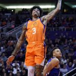 Phoenix Suns forward Kelly Oubre Jr. (3) dunks over New York Knicks forward Kevin Knox II (20) during the second half of an NBA basketball game Friday, Jan. 3, 2020, in Phoenix. The Suns won 120-112. (AP Photo/Rick Scuteri)