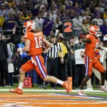 Clemson quarterback Trevor Lawrence scores against LSU during the first half of a NCAA College Football Playoff national championship game Monday, Jan. 13, 2020, in New Orleans. (AP Photo/David J. Phillip)