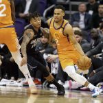 Orlando Magic's Markelle Fultz (20) tries to stay with Phoenix Suns' Elie Okobo (2) who dribbles around a pick during the first half of an NBA basketball game Friday, Jan. 10, 2020, in Phoenix. (AP Photo/Darryl Webb)