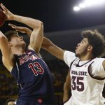 Arizona forward Stone Gettings (13) shoots over Arizona State forward Taeshon Cherry (35) during the first half of an NCAA college basketball game Saturday, Jan. 25, 2020, in Tempe, Ariz. (AP Photo/Ross D. Franklin)
