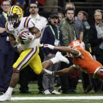 LSU wide receiver Ja'Marr Chase scores past Clemson cornerback A.J. Terrell during the first half of a NCAA College Football Playoff national championship game Monday, Jan. 13, 2020, in New Orleans. (AP Photo/Sue Ogrocki)
