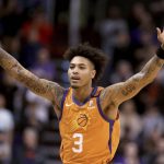 Phoenix Suns' Kelly Oubre Jr. celebrates late in the team's NBA basketball game against Orlando Magic on Friday, Jan. 10, 2020, in Phoenix. (AP Photo/Darryl Webb)