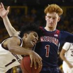 Arizona State guard Remy Martin, left, collides with Arizona guard Nico Mannion, right, during the second half of an NCAA college basketball game Saturday, Jan. 25, 2020, in Tempe, Ariz. Arizona State defeated Arizona 66-65. (AP Photo/Ross D. Franklin)