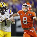 LSU wide receiver Ja'Marr Chase, left, catches a pass in front of Clemson cornerback A.J. Terrell during the first half of a NCAA College Football Playoff national championship game Monday, Jan. 13, 2020, in New Orleans. (AP Photo/Gerald Herbert)