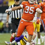 LSU quarterback Joe Burrow is sacked by Clemson defensive end Justin Foster during the first half of a NCAA College Football Playoff national championship game Monday, Jan. 13, 2020, in New Orleans. (AP Photo/David J. Phillip)