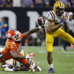 LSU safety Grant Delpit, right, breaks up a pass intended for Clemson wide receiver Tee Higgins during the first half of a NCAA College Football Playoff national championship game Monday, Jan. 13, 2020, in New Orleans. (AP Photo/Gerald Herbert)
