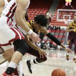 Washington State forward Jeff Pollard, left, and Arizona State guard Remy Martin go after the ball during the first half of an NCAA college basketball game in Pullman, Wash., Wednesday, Jan. 29, 2020. (AP Photo/Young Kwak)