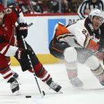 Arizona Coyotes right wing Phil Kessel (81) skates with the puck as he fakes out Anaheim Ducks center Carter Rowney, right, during the third period of an NHL hockey game Thursday, Jan. 2, 2020, in Glendale, Ariz. The Coyotes won 4-2. (AP Photo/Ross D. Franklin)