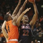 Arizona's Zeke Nnaji, right, is fouled by Oregon State's Alfred Hollins, left, during the first half of an NCAA college basketball game in Corvallis, Ore., Sunday, Jan. 12, 2020. (AP Photo/Chris Pietsch)