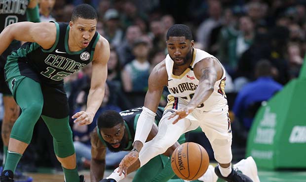 New Orleans Pelicans' E'Twaun Moore goes for a loose ball next to Boston Celtics' Grant Williams (1...