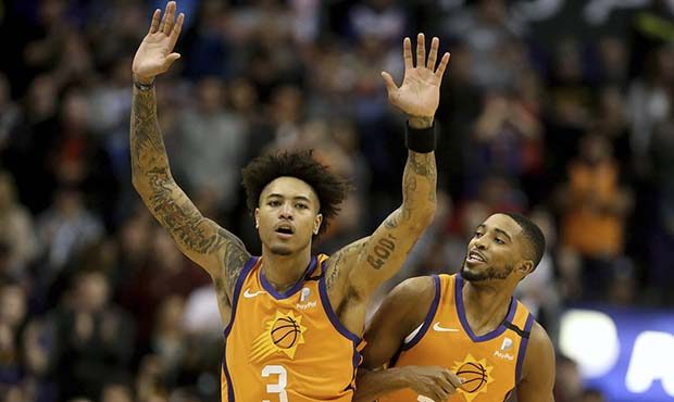 Phoenix Suns' Kelly Oubre Jr. (3) and Mikal Bridges (25) celebrate after coming back late in an NBA...