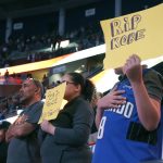 Orlando Magic fans hold up signs honoring Kobe Bryant during the first quarter of an NBA basketball game against the Los Angeles Clippers in Orlando, Fla., Sunday, Jan. 26, 2019. (AP Photo/Reinhold Matay)