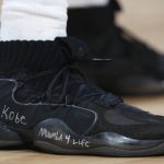 Houston Rockets guard Austin Rivers wears a pair of Adidas Crazy Eights with a tribute to Kobe Bryant written on the midsole in the second half of an NBA basketball game against the Denver Nuggets, Sunday, Jan. 26, 2020, in Denver. The Nuggets won 117-110. (AP Photo/David Zalubowski)