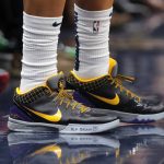 New Orleans Pelicans guard Frank Jackson bears a memorial message on his shoes for former NBA great Kobe Bryant, who died today in a helicopter crash, in the first half of an NBA basketball game against the Boston Celtics in New Orleans, Sunday, Jan. 26, 2020. (AP Photo/Gerald Herbert)