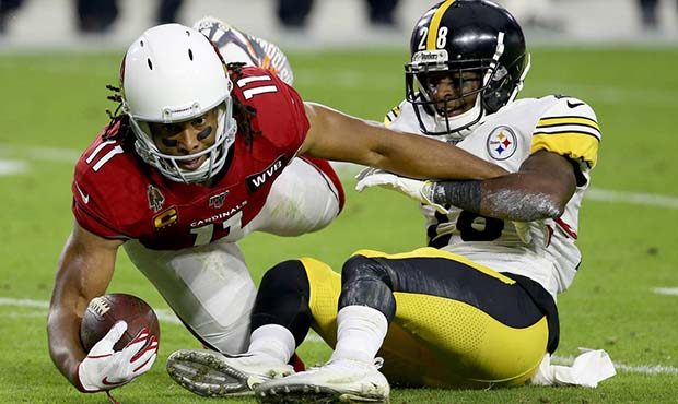 Arizona Cardinals wide receiver Larry Fitzgerald (11) is tackled by Pittsburgh Steelers cornerback ...