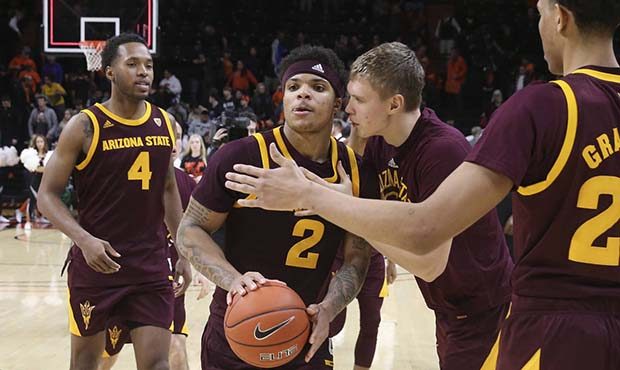 Arizona State's Rob Edwards (2) is congratulated by teammates after Arizona State defeated Oregon S...