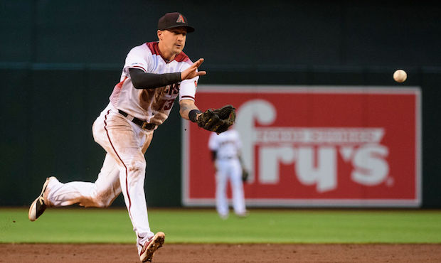 Nick Ahmed #13 of the Arizona Diamondbacks fields a ground ball in the third inning of the MLB game...