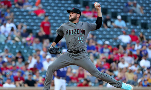 Alex Young #49 of the Arizona Diamondbacks pitches against the Texas Rangers in the bottom of the f...