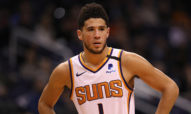 Devin Booker #1 of the Phoenix Suns during the NBA game against the Sacramento Kings at Talking Sti...