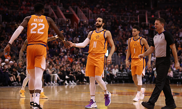 Ricky Rubio #11 of the Phoenix Suns high fives Deandre Ayton #22 after scoring against the Houston ...