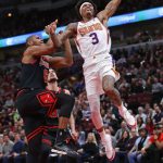 CHICAGO, ILLINOIS - FEBRUARY 22: Kelly Oubre Jr. #3 of the Phoenix Suns goes up for a dunk over Cristiano Felicio #6 of the Chicago Bulls at the United Center on February 22, 2020 in Chicago, Illinois. The Suns defeated the Bulls 112-104. NOTE TO USER: User expressly acknowledges and agrees that, by downloading and or using this photograph, User is consenting to the terms and conditions of the Getty Images License Agreement. (Photo by Jonathan Daniel/Getty Images)