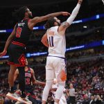 CHICAGO, ILLINOIS - FEBRUARY 22: Ricky Rubio #11 of the Phoenix Suns puts up a shot past Coby White #0 of the Chicago Bulls at the United Center on February 22, 2020 in Chicago, Illinois. The Suns defeated the Bulls 112-104. NOTE TO USER: User expressly acknowledges and agrees that, by downloading and or using this photograph, User is consenting to the terms and conditions of the Getty Images License Agreement. (Photo by Jonathan Daniel/Getty Images)