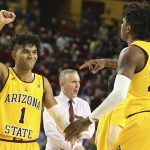 Arizona State's Remy Martin (1) and Romello White (23) celebrate during the first half of the team's NCAA college basketball game against UCLA on Thursday, Feb. 6, 2020, in Tempe, Ariz. (AP Photo/Darryl Webb)