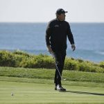 Phil Mickelson reacts after missing a birdie putt on the fourth green of the Pebble Beach Golf Links during the final round of the AT&T Pebble Beach National Pro-Am golf tournament Sunday, Feb. 9, 2020, in Pebble Beach, Calif. (AP Photo/Eric Risberg)