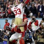San Francisco 49ers' Tarvarius Moore (33) is called for pass interference on Kansas City Chiefs' Travis Kelce during the second half of the NFL Super Bowl 54 football game Sunday, Feb. 2, 2020, in Miami Gardens, Fla. (AP Photo/Lynne Sladky)