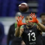 Texas wide receiver Devin Duvernay runs a drill at the NFL football scouting combine in Indianapolis, Thursday, Feb. 27, 2020. (AP Photo/Michael Conroy)