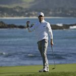 Nick Taylor, of Canada, reacts on the 18th green of the Pebble Beach Golf Links after winning the AT&T Pebble Beach National Pro-Am golf tournament Sunday, Feb. 9, 2020, in Pebble Beach, Calif. (AP Photo/Eric Risberg)