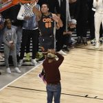 Orlando Magic's Aaron Gordon dunks over Chance the Rapper during the NBA All-Star slam dunk contest Saturday, Feb. 15, 2020, in Chicago. (AP Photo/David Banks)