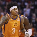 Phoenix Suns forward Kelly Oubre Jr. celebrates his three-point basket against the Houston Rockets during the first half of an NBA basketball game Friday, Feb. 7, 2020, in Phoenix. (AP Photo/Ross D. Franklin)