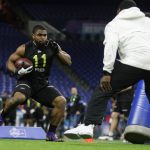 LSU running back Clyde Edwards-Helaire runs a drill at the NFL football scouting combine in Indianapolis, Friday, Feb. 28, 2020. (AP Photo/Michael Conroy)
