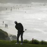 Dustin Johnson cups the ball onto the ninth green of the Pebble Beach Golf Links during the third round of the AT&T Pebble Beach National Pro-Am golf tournament Saturday, Feb. 8, 2020, in Pebble Beach, Calif. (AP Photo/Eric Risberg)