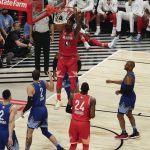 Jimmy Butler of the Miami Heat dunks during the first half of the NBA All-Star basketball game Sunday, Feb. 16, 2020, in Chicago. (AP Photo/David Banks)
