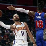Phoenix Suns guard Ricky Rubio (11) passes as Detroit Pistons guard Jordan Bone (18) defends during the first half of an NBA basketball game, Wednesday, Feb. 5, 2020, in Detroit. (AP Photo/Carlos Osorio)
