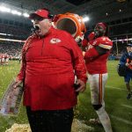Kansas City Chiefs head coach Andy Reid reacts after being doused during the second half of the NFL Super Bowl 54 football game against the San Francisco 49ers Sunday, Feb. 2, 2020, in Miami Gardens, Fla. (AP Photo/David J. Phillip)
