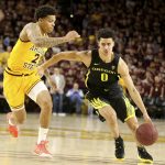 Oregon's Will Richardson (0) drive up the middle against Arizona State's Rob Edwards (2) during the first half of an NCAA college basketball game Thursday, Feb. 20, 2020, in Tempe, Ariz. (AP Photo/Darryl Webb)