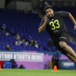 Rhode Island offensive lineman Kyle Murphy runs a drill at the NFL football scouting combine in Indianapolis, Friday, Feb. 28, 2020. (AP Photo/Michael Conroy)
