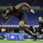 LSU linebacker Jacob Phillips runs a drill at the NFL football scouting combine in Indianapolis, Saturday, Feb. 29, 2020. (AP Photo/Michael Conroy)
