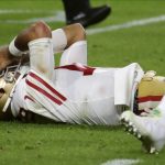 San Francisco 49ers quarterback Jimmy Garoppolo lays on the ground after being hit during the second half of the NFL Super Bowl 54 football game against the Kansas City Chiefs Sunday, Feb. 2, 2020, in Miami Gardens, Fla. (AP Photo/Matt York)