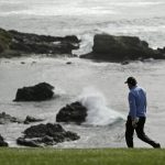 Phil Mickelson walks down the fairway to the eighth green of the Pebble Beach Golf Links during the third round of the AT&T Pebble Beach National Pro-Am golf tournament Saturday, Feb. 8, 2020, in Pebble Beach, Calif. (AP Photo/Eric Risberg)