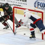 Arizona Coyotes left wing Lawson Crouse (67) scores an empty-net goal as Washington Capitals left wing Alex Ovechkin (8) arrives late to defend during the third period of an NHL hockey game Saturday, Feb. 15, 2020, in Glendale, Ariz. The Coyotes won 3-1. (AP Photo/Ross D. Franklin)