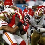 Kansas City Chiefs' Damien Williams, second from right, is tackled against the San Francisco 49ers during the second half of the NFL Super Bowl 54 football game Sunday, Feb. 2, 2020, in Miami Gardens, Fla. (AP Photo/Mark Humphrey)
