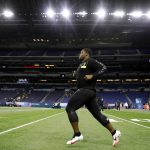 LSU offensive lineman Saahdiq Charles warms up at the NFL football scouting combine in Indianapolis, Friday, Feb. 28, 2020. (AP Photo/Charlie Neibergall)