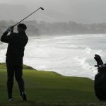 Macklemore follows his shot from the ninth fairway of the Pebble Beach Golf Links during the third round of the AT&T Pebble Beach National Pro-Am golf tournament Saturday, Feb. 8, 2020, in Pebble Beach, Calif. (AP Photo/Eric Risberg)