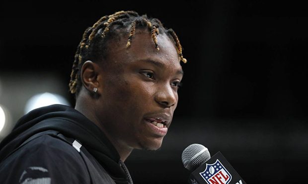 Alabama wide receiver Henry Ruggs III speaks during a press conference at the NFL football scouting...