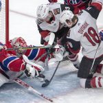 Arizona Coyotes right wing Conor Garland (83) and centre Christian Dvorak (18) go after a loose puck in front of Montreal Canadiens goaltender Carey Price (31) during second period NHL hockey action, Monday, Feb. 10, 2020 in Montreal. (Ryan Remiorz/The Canadian Press via AP)